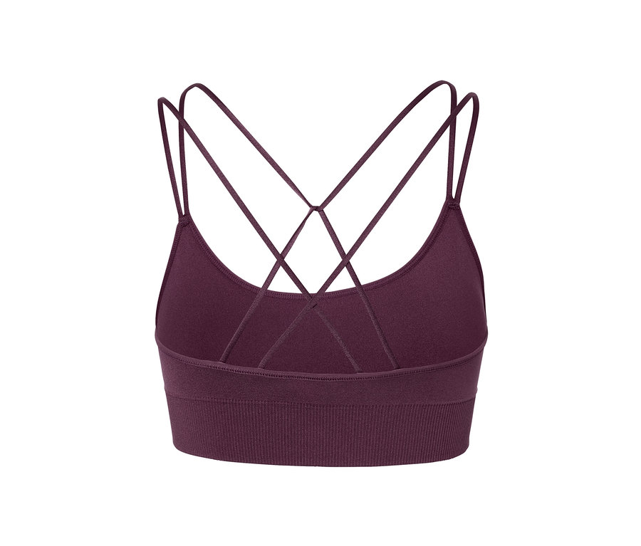 Egy lila Bustier sportmelltartó részlete, hátul keresztezett pántokkal.