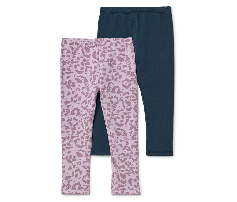 Két leggings, egy sötétkék és egy világos rózsaszín leopárdmintás, egymáson fekszik.