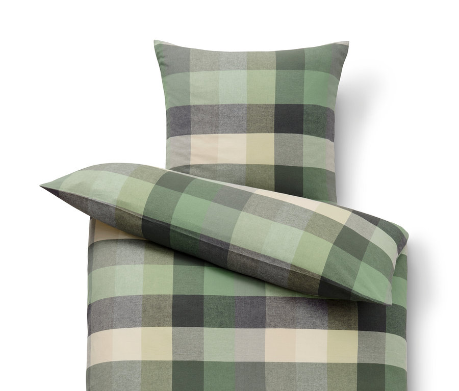 Kockás flanel ágynemű: paplanhuzat, párna és hengerpárna.