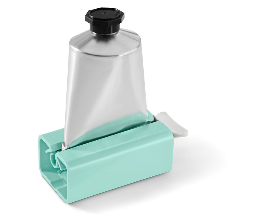 Ezüst színű tubus fekete kupakkal, türkizkék tubusnyomóban.