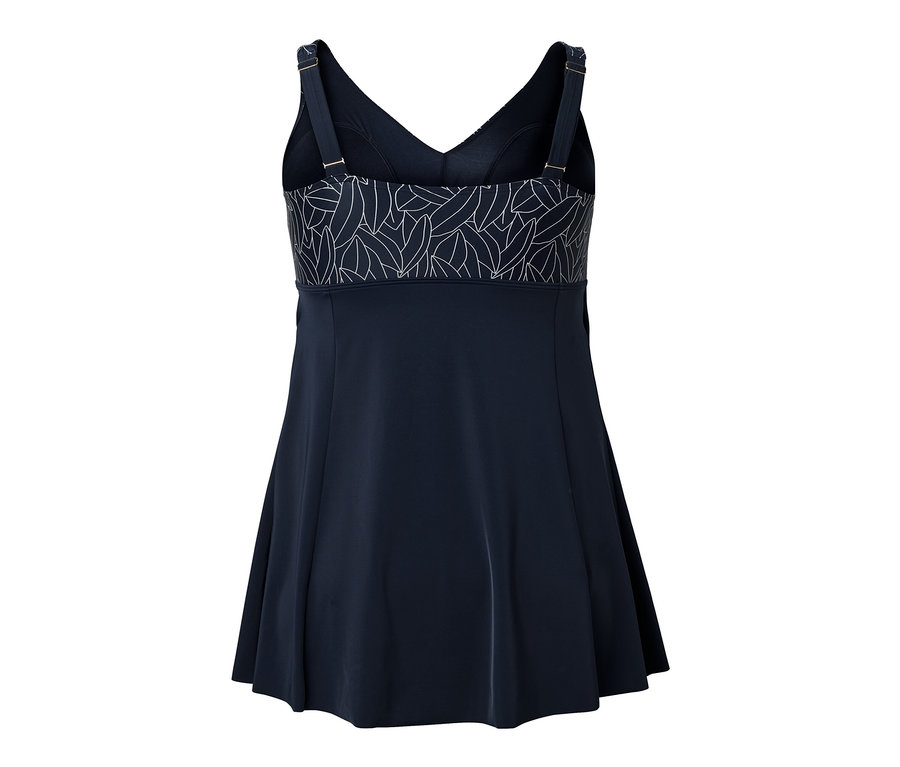 Közelkép egy fürdőruha hátuljáról, fehér levélmintával a felső részén.