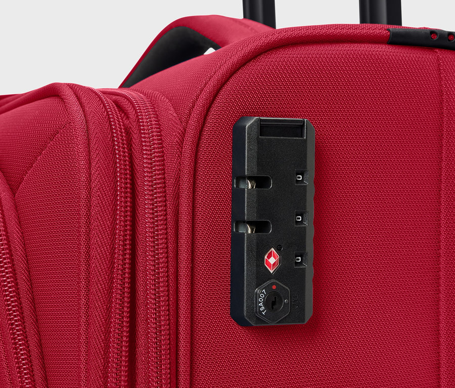 Egy piros bőrönd közeli képe számzárral.